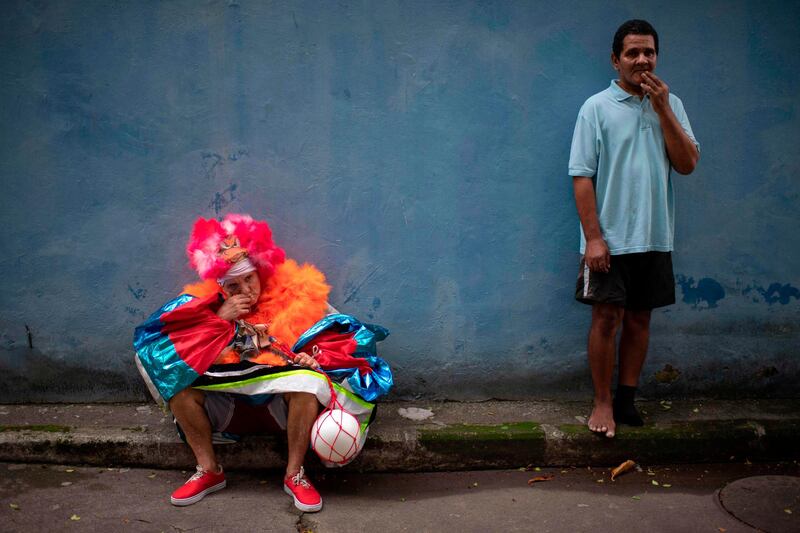 Revellers wait to take part in a street carnival parade of the "Loucura Suburbana"  at the Engenho de Dentro neighborhood in Rio de Janeiro, Brazil.  AFP