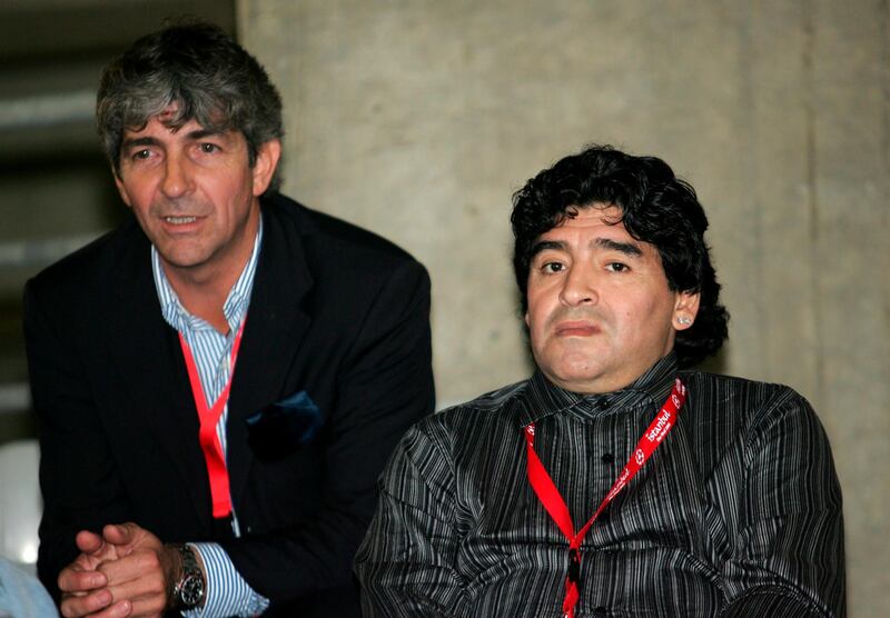 Diego Maradona and  Rossi watch an AC Milan training session in Istanbul in 2005. EPA