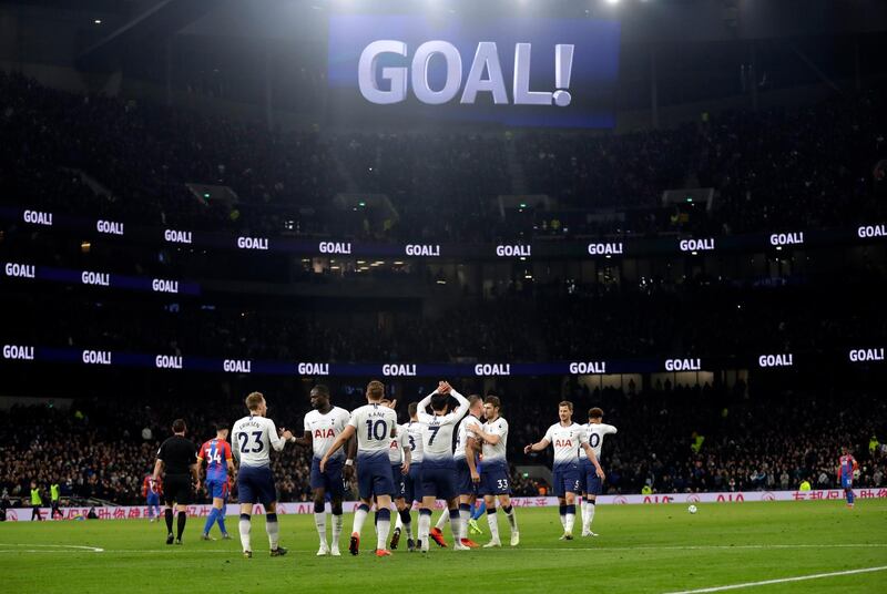 Tottenham players celebrate a win that boosts their hopes of finishing in the top four in the Premier League. AP