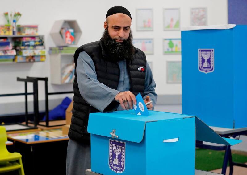 A Muslim Arab Israeli casts his vote in the country's parliamentary elections at a polling station in the Arab city of Tamra in northern Israel on March 2, 2020.  AFP