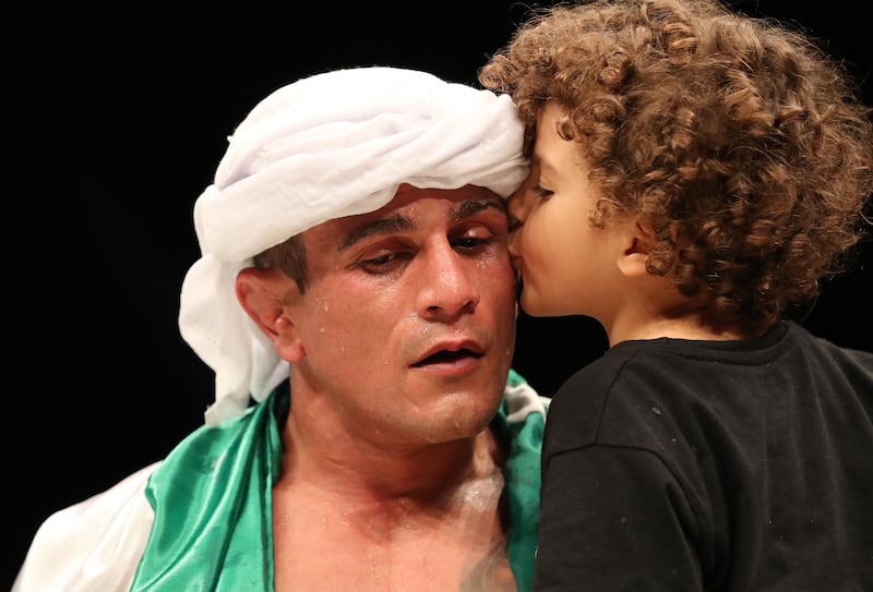 Bruno Machado with his son after his bout with Anderson Silva.