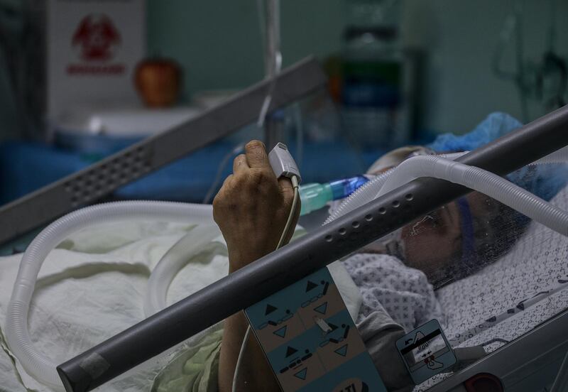 A Palestinian patient with coronavirus in the intensive care unit at the European Hospital, east of Rafah town, southern Gaza strip, 30 November 2020. The European Hospital, which has been classified as the Epidemiology Hospital since the start of the coronavirus in the Gaza Strip on 25 August 2020, has 334 infected cases under clinical care including 109 severe and critical cases. The production capacity of oxygen is 2,200 liters per minute, and there has become a large deficit after the increasing number of infections with Coronavirus.  EPA/MOHAMMED SABER