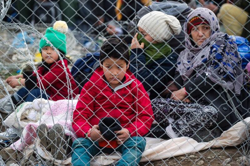 Migrants from Afghanistan stage a protest at the Greek-Macedonian border, near Gevgelija against Macedonia's refusal to allow Afghans to pass the border. Robert Atanasovski / AFP

