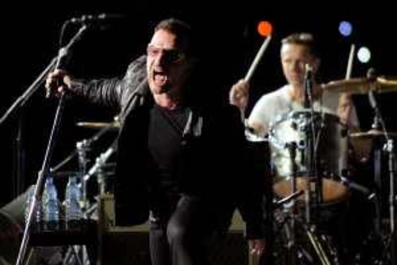 Bono, left, and Larry Mullen Jr. of U2 perform during their 360 world tour stop at the Rose Bowl in Pasadena, Calif., Sunday, Oct. 25, 2009. (AP Photo/Chris Pizzello)