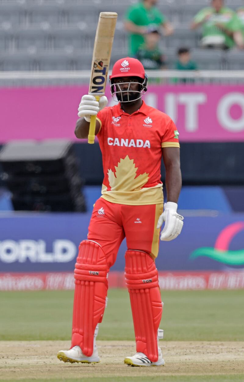 Aaron Johnson celebrates reaching his half-century for Canada. His knock of 52 included four sixes and four fours helped his team reach 106-7. AP