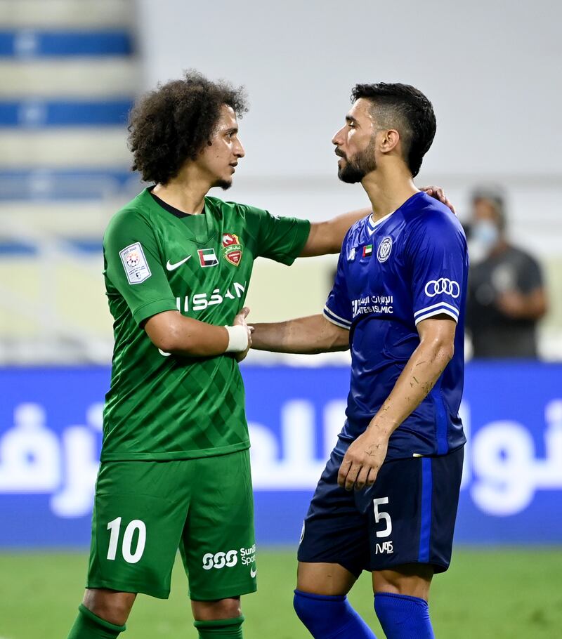 Omar Abdulrahman shakes hands with an Al Nasr player at the end of the match.