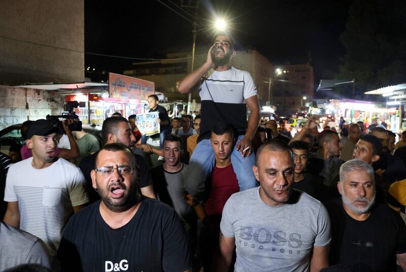Palestinians shout slogans as they celebrate the escape of six Palestinians from an Israeli prison, in the Jenin camp in the northern Israeli-occupied West Bank.   Six Palestinians broke out of a prison in northern Israel prison through a tunnel dug beneath a sink, triggering a massive manhunt for the group that includes a prominent ex-militant.  AFP
