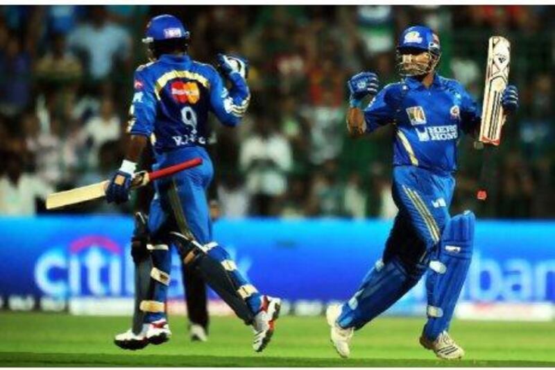 Sachin Tendulkar, right, and Ambati Rayudu put on a 110-run stand for Mumbai against Bangalore at Chinnaswamy Stadium last night.