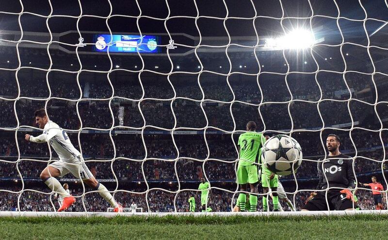 Real Madrid forward Alvaro Morata celebrates after scoring a late winner against Sporting Lisbon. The match ended 2-1 to Real Madrid. Gerard Julien / AFP