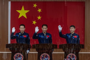 Chinese astronauts Tang Hongbo, Nie Haisheng, and Liu Boming from China's Manned Space Agency, who are due to embark on the country's manned mission in five years. Getty Images