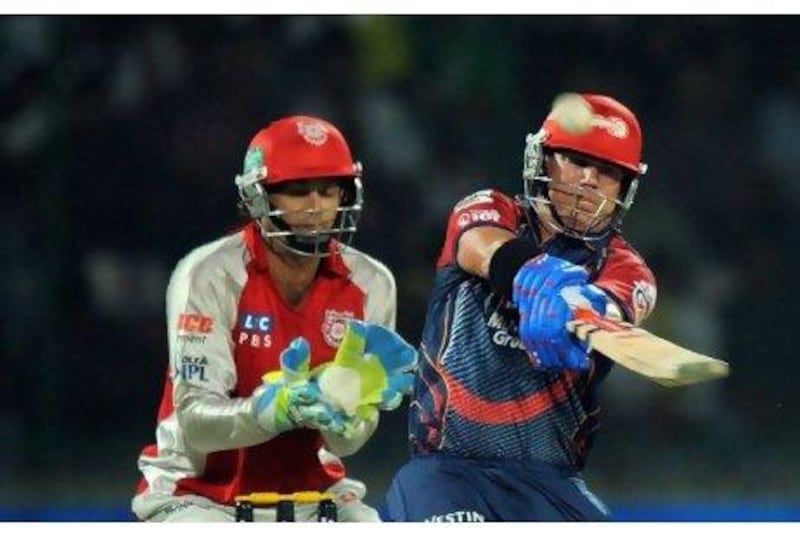 David Warner, the Delhi Daredevils opening batsman, right, on his way to a well-crafted 77 against Kings XI Punjab yesterday.