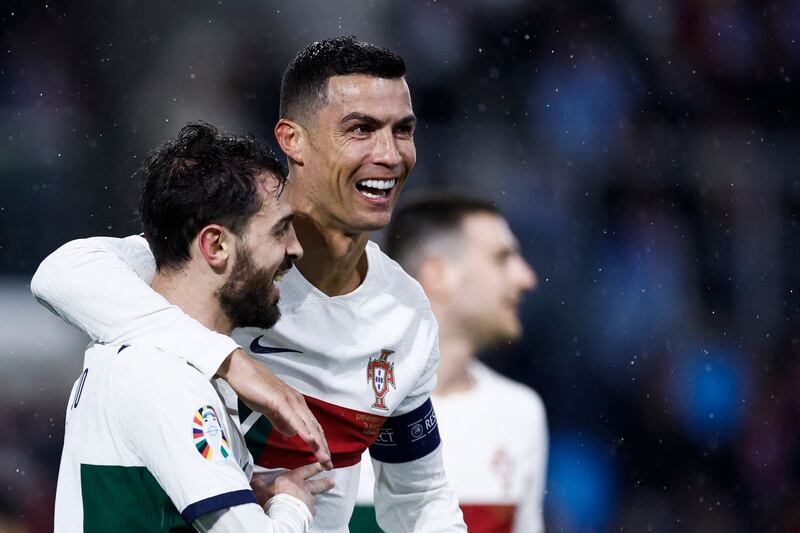 Portugal's Cristiano Ronaldo celebrates with Bernardo Silva. AFP