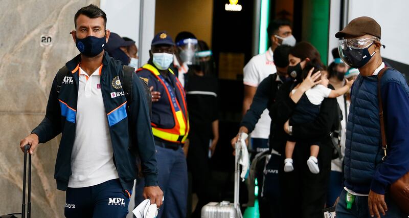 Cheteshwar Pujara arrives with his India teammates in Johannesburg. AP