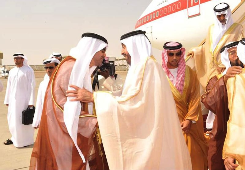 President Sheikh Khalifa, right, is greeted at the Al Ain airport by Sheikh Mohammed. WAM