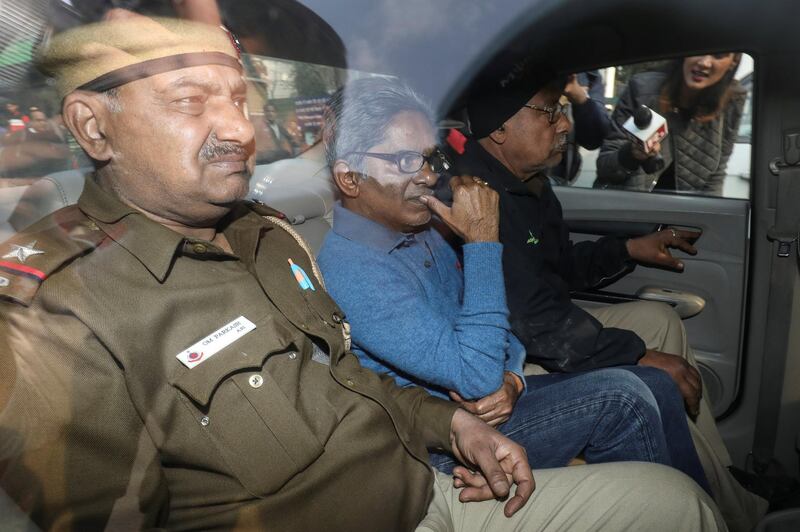 Rajiv Saxena (C), an accused in India's abortive, scandal-tainted helicopter deal with Anglo-Italian firm Agusta Westland, is pictured inside a vehicle outside a court in New Delhi, India, January 31, 2019. REUTERS/Anushree Fadnavis