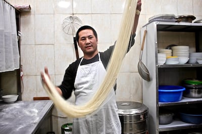 Eisa Ma has been pulling and kneading noodles for the past year at the Islamic Chinese Restaurant in Amman, Jordan. Miriam Berger