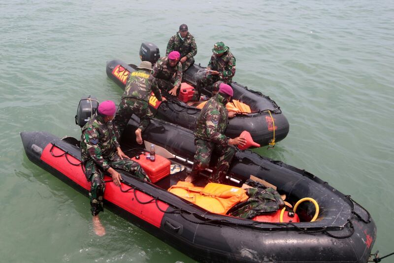 Emergency personnel scour the area in rigid inflatable boats. EPA