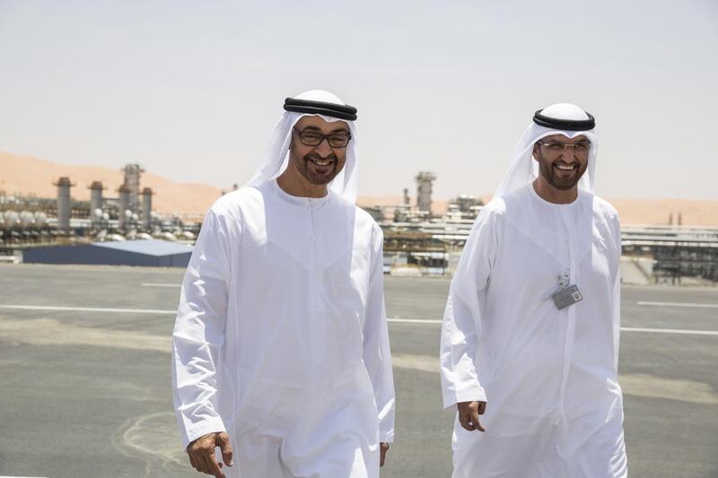 Sheikh Mohammed bin Zayed, left, Crown Prince of Abu Dhabi and Deputy Supreme Commander of the UAE Armed Forces, with Sultan Al Jaber, chief executive of Adnoc, during the inauguration of the Al Hosn gas facility. Ryan Carter / Crown Prince Court - Abu Dhabi