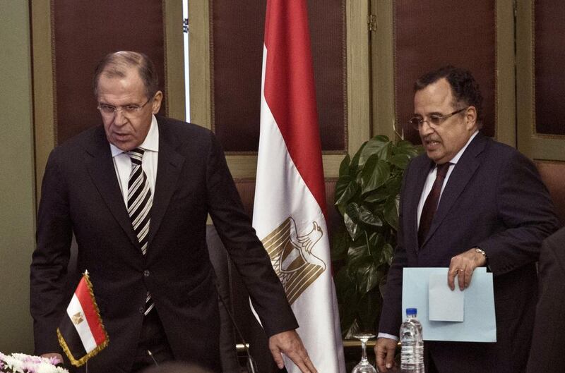 The Egyptian foreign minister Nabil Fahmy, right, and his Russian counterpart, Sergey Lavrov, arrive for a press conference in Cairo on November 14. Khaled Desouki / AFP