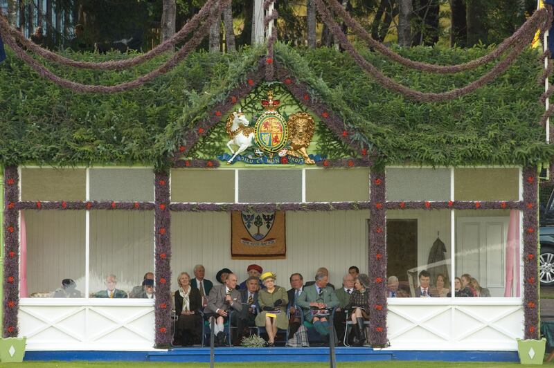 The royal family watch proceedings from their box at the 2009 Braemar Highland Games.