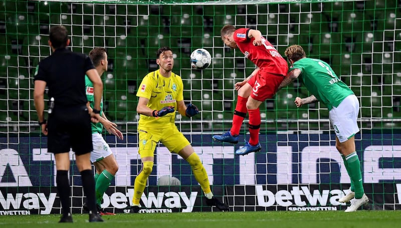Mitchell Weiser, center, of Leverkusen scores his team's 3rd goal during the German Bundesliga soccer match between Werder Bremen and Bayer Leverkusen 04 in Bremen, Germany. AP Photo