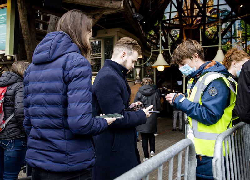 Visitors to Efteling Park have their CoronaCheck App QR code scanned at the entrance of the amusement park in Kaatsheuvel. EPA
