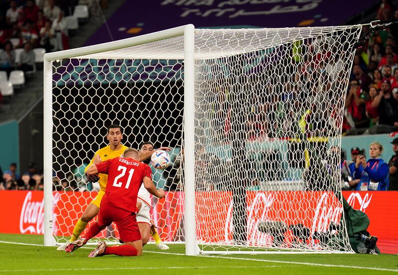 Denmark's Andreas Cornelius misses a chance from close range. PA