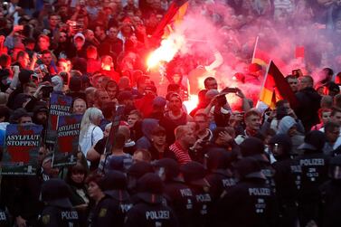  Right wing demonstrators light flares during protests in Chemnitz in 2018. AFP