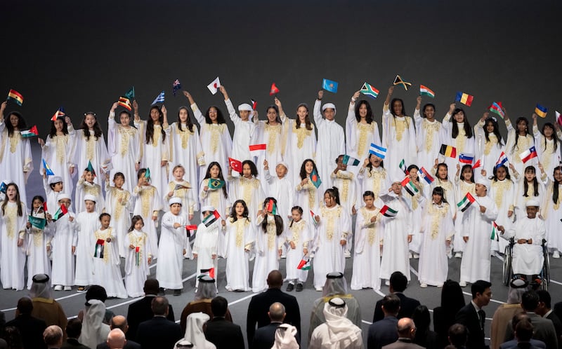 Children sing the UAE national anthem . Photo: Presidential Court