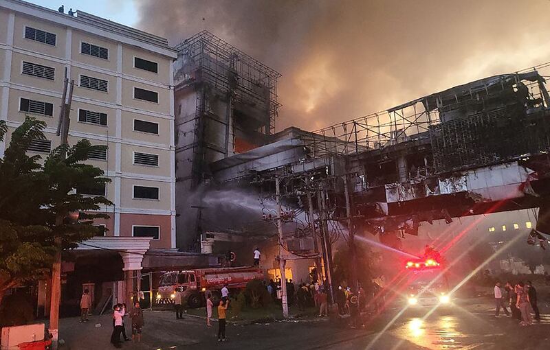 Firefighters battle a deadly fire at the Grand Diamond City hotel and casino in Poipet, Cambodia. AFP