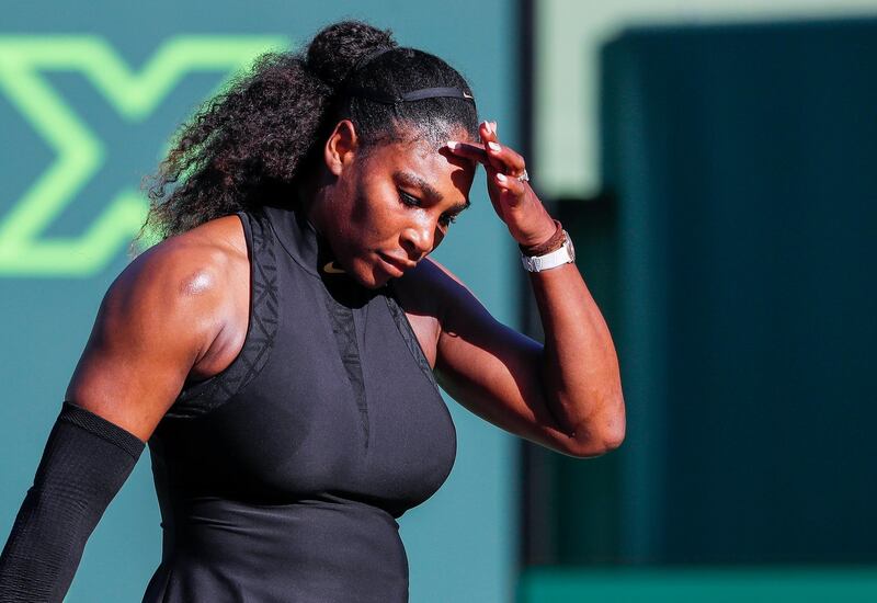 epa06619091 Serena Williams of the US reacts against Naomi Osaka of Japan during a first round match at the Miami Open tennis tournament on Key Biscayne, Miami, Florida, USA, 21 March 2018.  EPA/ERIK S. LESSER