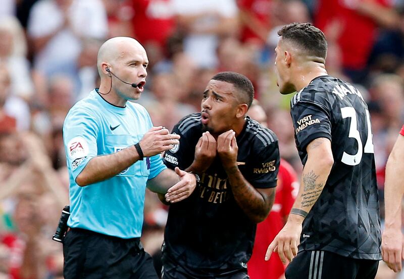 Arsenal's Gabriel Jesus and Granit Xhaka argue with referee Paul Tierney. Reuters