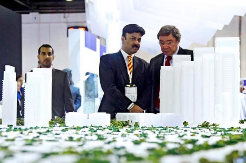 Dubai, UAE, October 2, 2012:

Cityscape, an event, being held inside of the World Trade Center Exhibition Halls, is a showcase for international urban projects.

Visitors look at SOBA's latest project, SOBA City, which will be built in the area known as the Meydan Racetrack (the land encompasses the track).


Lee Hoagland/The National