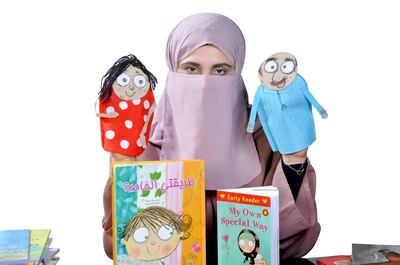 Maitha al Khayat is a prolific children's book author in both Arabic and English, shown with her book 'My Own Special Way.' Maitha Al Khayat
