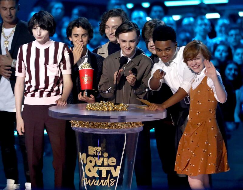 Finn Wolfhard, from left, Jack Dylan Grazer, Wyatt Oleff, Jaeden Lieberher, Jeremy Ray Taylor, Chosen Jacobs and Sophia Lillis accept the award for best on-screen team for 'It' AP