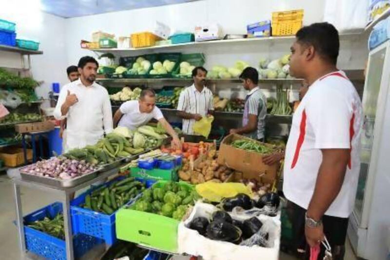 A fruit and vegetable shop at the Tourist Club area in Abu Dhabi. The Statistics Centre Abu Dhabi says prices have risen over Ramadan, prompting the FNC to call for further investigation. Ravindranath K / The National