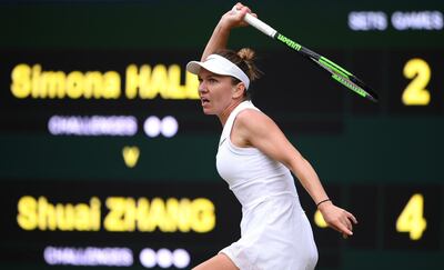 LONDON, ENGLAND - JULY 09: Simona Halep of Romania returns the ball in her Ladies' Singles Quarter Final match against Shuai Zhang of China during Day Eight of The Championships - Wimbledon 2019 at All England Lawn Tennis and Croquet Club on July 09, 2019 in London, England. (Photo by Matthias Hangst/Getty Images)