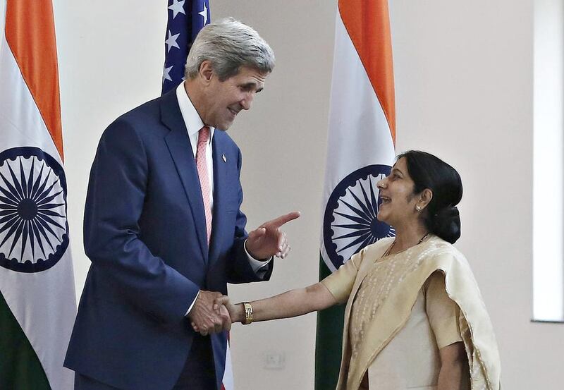 The US secretary of state John Kerry shakes hands with India’s external affairs minister, Sushma Swaraj, before the start of their meeting in New Delhi on July 31, 2014. Adnan Abidi / Reuters