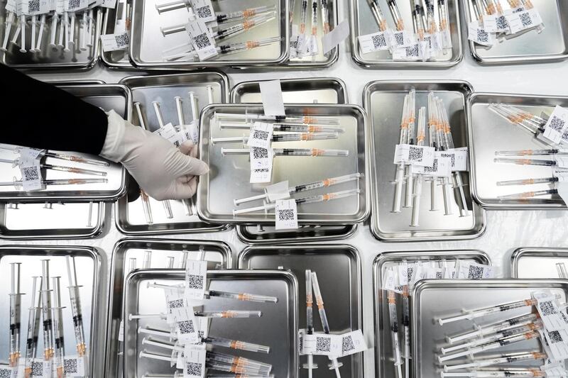 Syringes filled with doses of the AstraZeneca shot are prepared at the Central Vaccination Centre, inside the Bang Sue Grand Station in Bangkok, Thailand. Reuters