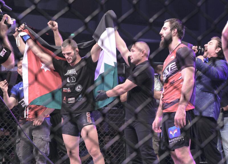 Abu Dhabi, United Arab Emirates, October 4, 2019.   --  Brave Combat Federation 27 at the Mubadala Arena.
Welterweight:
 (Left) The new champion, Jarrah Al Selawe (JOR) after defeating Abdoul Abdouraguimov.  (FRA) 
Victor Besa / The National
Section:  SP
Reporter:  Amith Passela