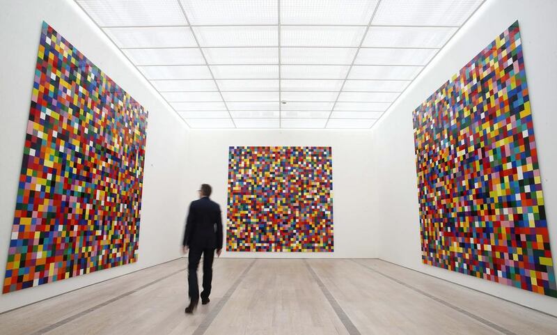 A man walks in front of the enamel on alu dibond 4900 Colors from 2007 by German artist Gerhard Richter during a media preview of the exhibition Gerhard Richter at the Fondation Beyeler in Riehen near Basel 16 May, 2014. Reuters