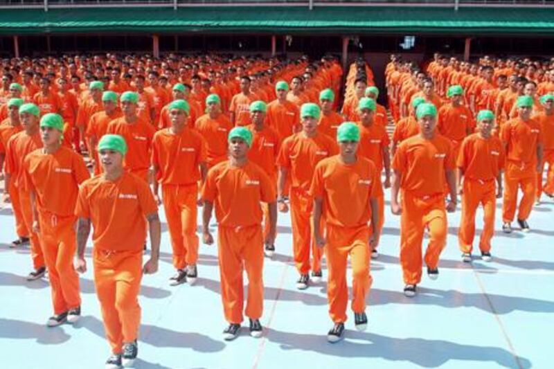 Inmates of Cebu Provincial Detention and Rehabilitation Center perform during the taping of the movie Dance of the Steel Bars. AP