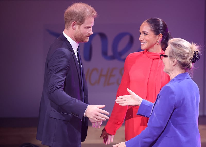 Prince Harry and his wife Meghan are welcomed to the opening ceremony of the One Young World summit. Reuters