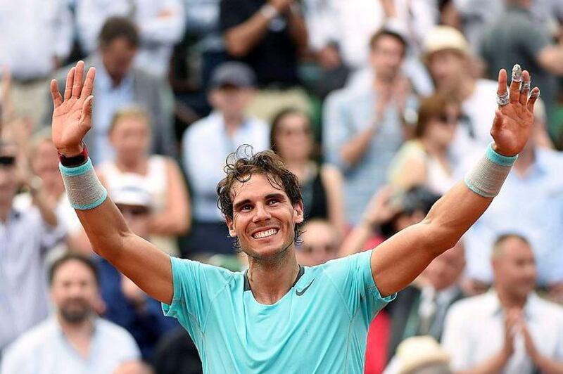 Spain's Rafael Nadal celebrates after winning a record ninth French Open final, beating Serbia's Novak Djokovic in Paris. Miguel Medina / AFP / June 8, 2014