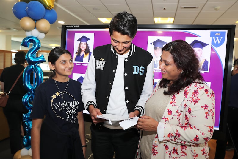 Devansh Singhi one of the boys topper celebrating with his sister and mother after getting the IB results at the GEMS Wellington Academy in Silicon Oasis in Dubai. Pawan Singh / The National