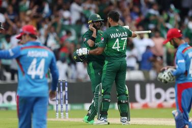 Pakistan's Imad Wasim and Wahab Riaz celebrate winning their World Cup match against Afghanistan. Lee Smith / Reuters