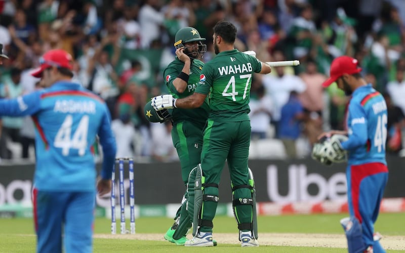 Cricket - ICC Cricket World Cup - Pakistan v Afghanistan - Headingley, Leeds, Britain - June 29, 2019   Pakistan's Imad Wasim and Wahab Riaz celebrate winning the match       Action Images via Reuters/Lee Smith