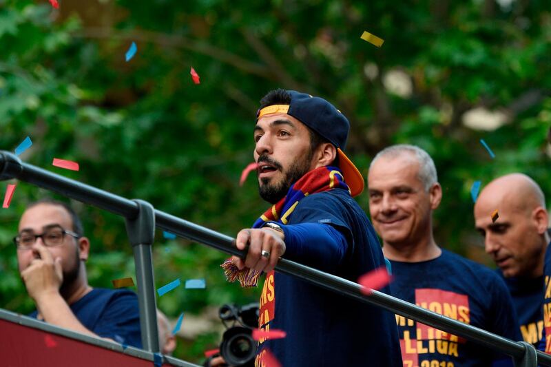 Luis Suarez takes part in the ope-top bus celebrations. Lluis Gene / AFP