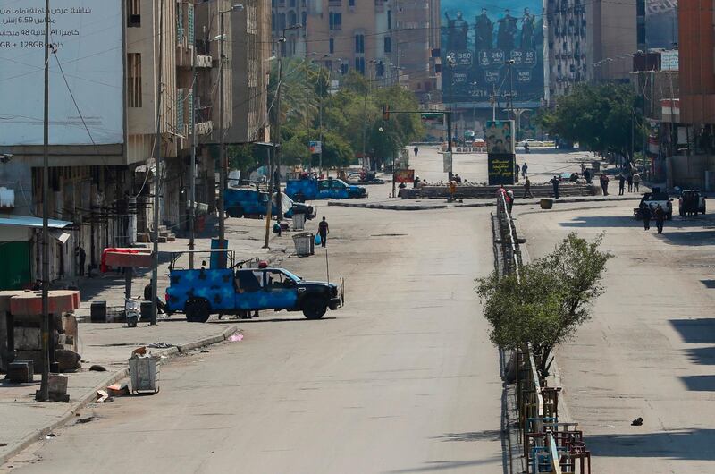 Security forces are deployed to impose the curfew in central Baghdad. AP Photo
