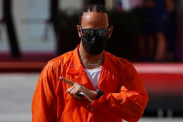 Formula One F1 - Abu Dhabi Grand Prix - Yas Marina Circuit, Abu Dhabi, United Arab Emirates - December 10, 2021 Mercedes' Lewis Hamilton arrives ahead of practice REUTERS / Hamad I Mohammed